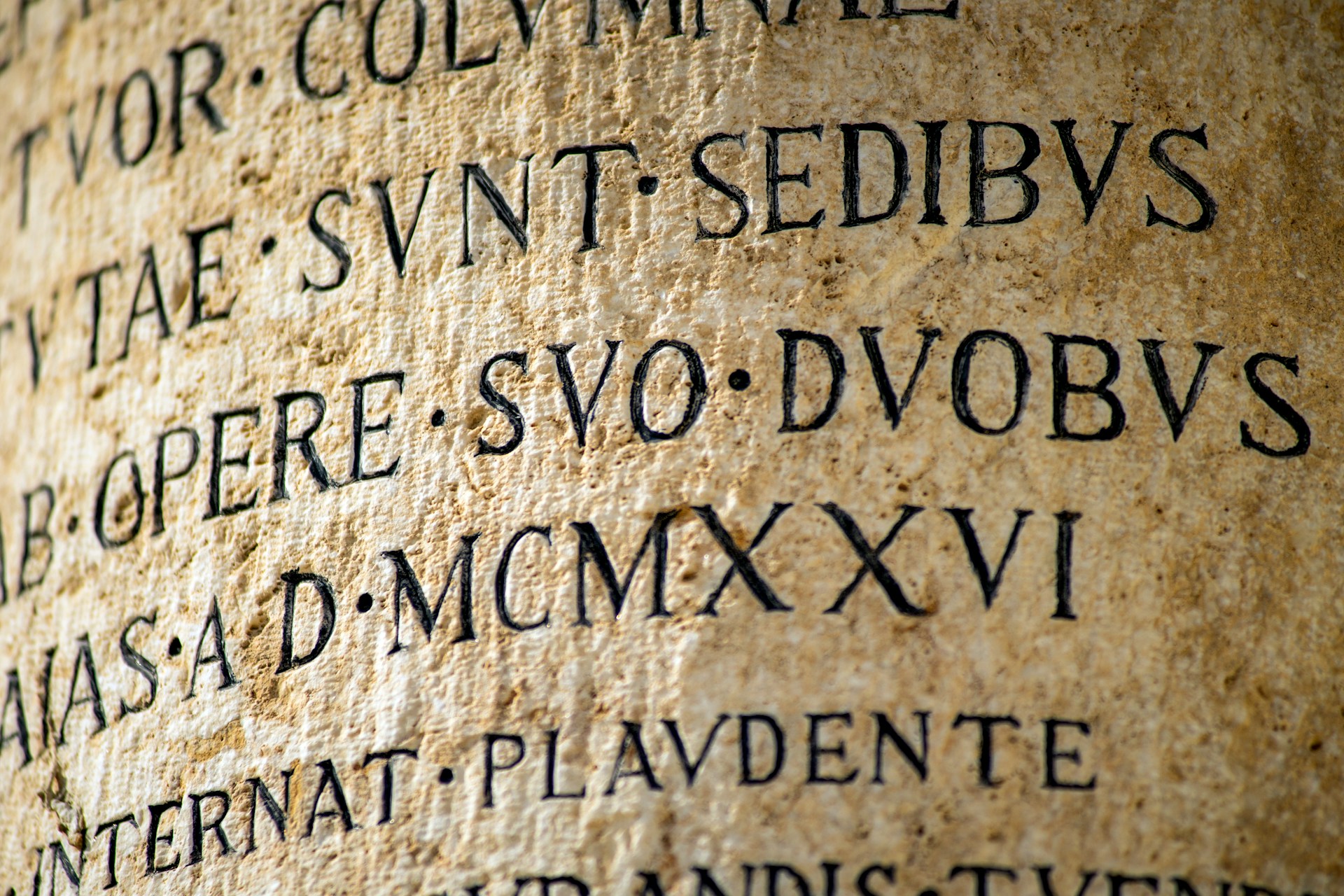 Latin text on an ancient column.
